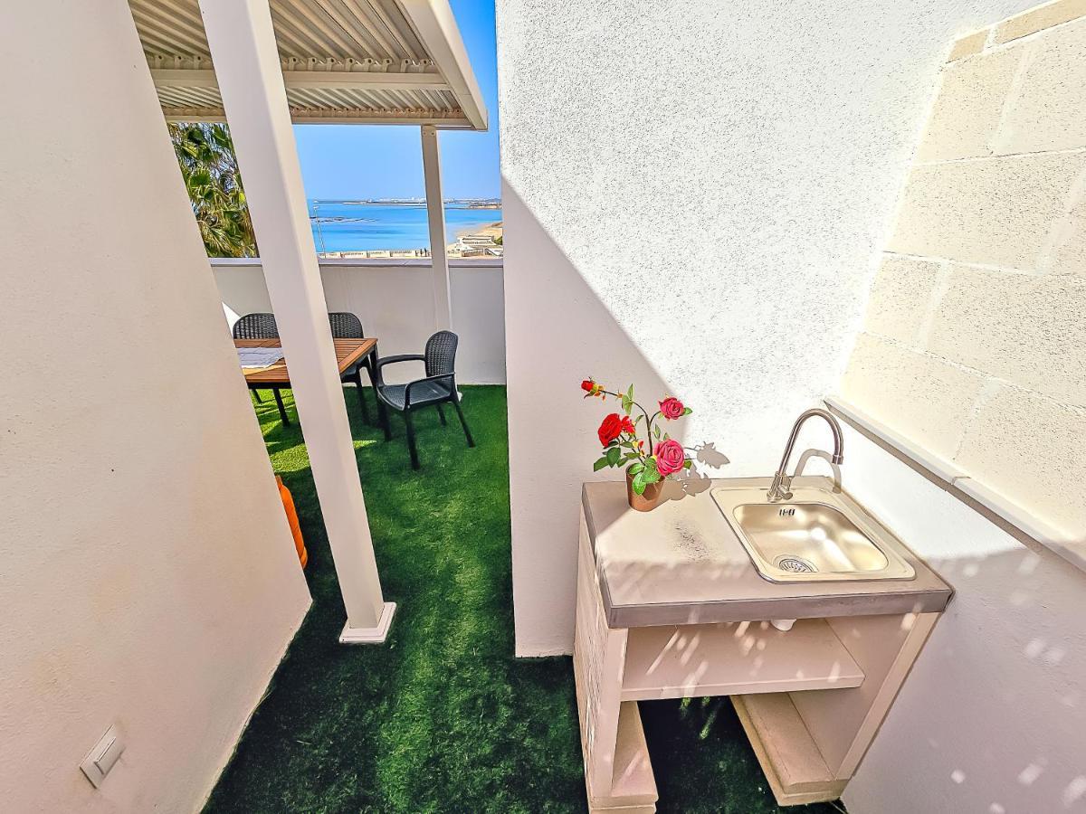 Oceanfront Duplex With A Rooftop Pool And Terrace El Puerto de Santa Maria Bagian luar foto